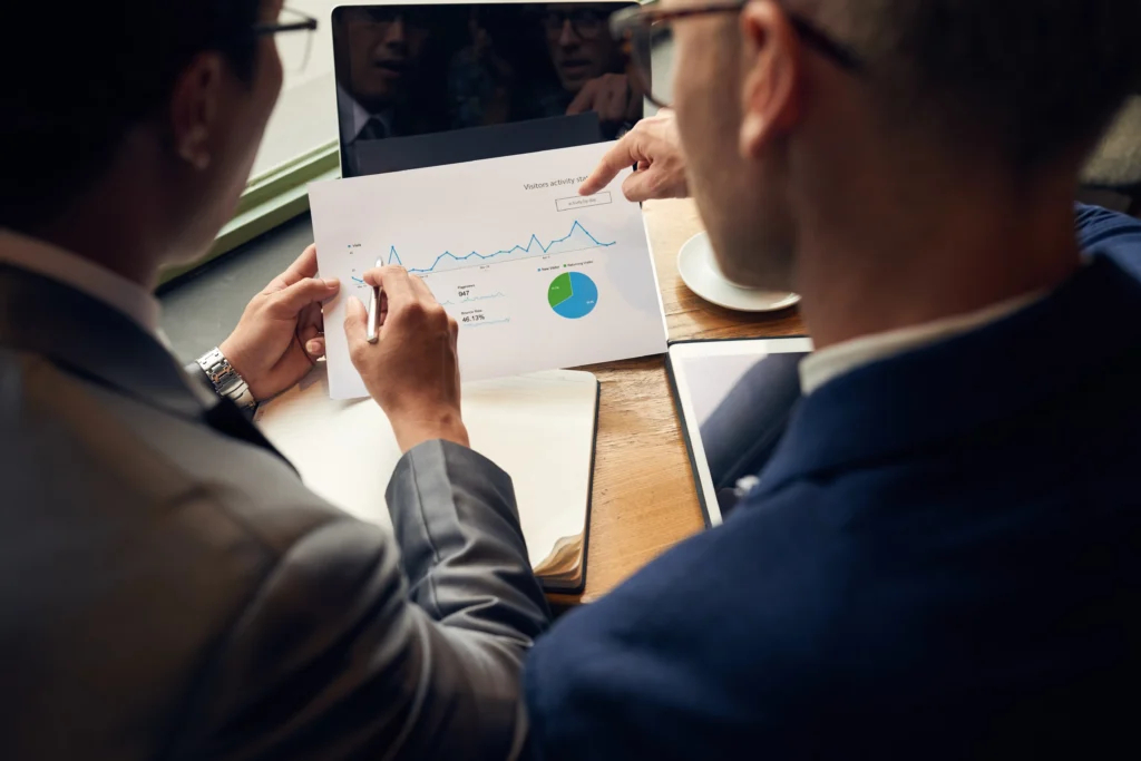two healthcare professionals analyzing data and discussing ai solutions for healthcare