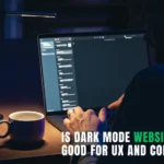 Person working on a laptop with dark mode interface at night